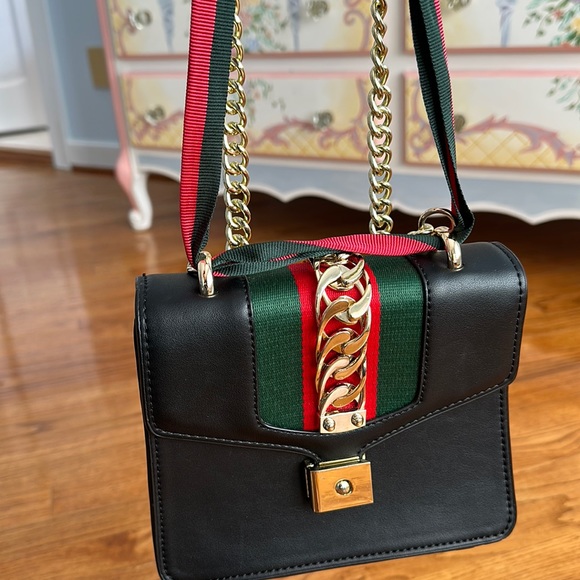 Fun black leather bag with gold chain accents - Picture 1 of 5